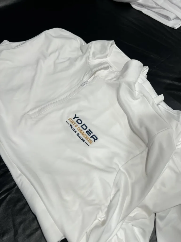 Yoder Family white quarter-zip